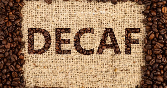 Coffee beans surrounding the word 'DECAF' displayed on a burlap coffee sack background
